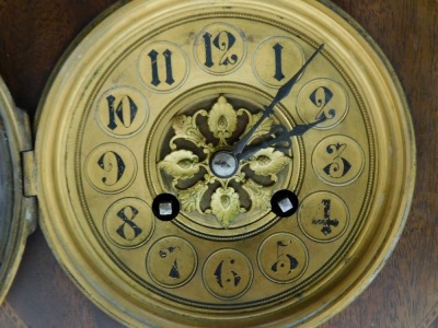 A Victorian mahogany and inlaid mantel clock, circular brass dial, with chapter ring bearing Arabic numerals, Japy Freres & Cie, with coil strike, the case of domed form, raised on brass columns, above a rectangular base, on brass ball feet, no key, 26.5c - 2