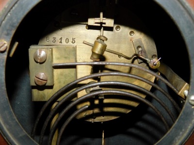 A Victorian mahogany and inlaid mantel clock, circular brass dial, with chapter ring bearing Arabic numerals, Japy Freres & Cie, with coil strike, the case of domed form, raised on brass columns, above a rectangular base, on brass ball feet, no key, 26.5c - 3