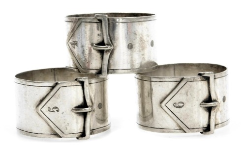 Three buckle napkin rings, numbered 4, 5 and 6, silver plated. (3)