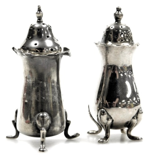 Two salt and pepper shakers, comprising George V silver salt shaker 0.7oz, and a plated example. (2)