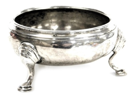 A Georgiae II silver circular salt, raised on three hoof feet, David Mowden, London 1751, 1.53oz.