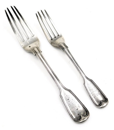 Two Victorian silver Old English pattern forks, comprising a table and starter fork, each bearing the inscription JBM from Lottie 30 December 1881, London 1880, 4.53oz. (2)