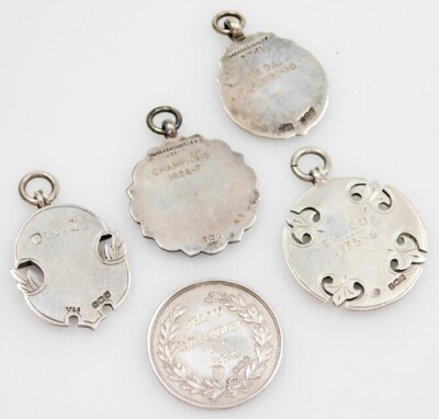 Five silver shield fobs, for the Notts Amateur Combination League, Culverthorpe and District League, Derby and District Amateur League, Insurance Athletic Association Championship, and a C&DL crest, each enamel decorated, 53.8g all in. (5) - 2