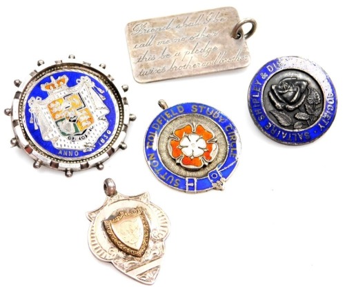 Various silver crests and pendants, comprising an 1830 silver coin brooch, enamel decorated, a Sutton Coldfield Study Circle silver and enamel pendant, a silver and enamel Saltaire Shipley and District Rose Society badge, a shield fob, and a dog tag penda