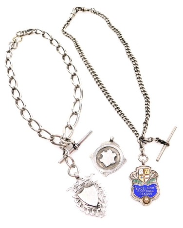 A silver Figaro link watch chain, with altered clasp, T bar and shield, the chain 30cm long, a curb link watch chain with clips and T bar, 40cm long, a silver enamel Football League shield badge and another shield, 104.4g all in.