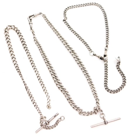 Three silver chains, comprising a curb link watch chain with two clips and T bar, 40cm long, a partial chain with T bar, 33cm long, and a further example with two clips and clasp, 30cm long, 4.10oz. (3)