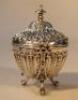 A Victorian silver vase shaped tea caddy and cover