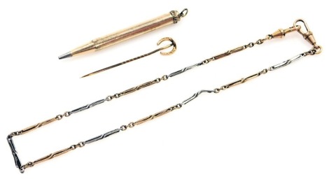 A 9ct gold horseshoe mounted stick pin, 0.7g, a gold plated watch chain, with two clips, and a rolled gold pencil case. (3)