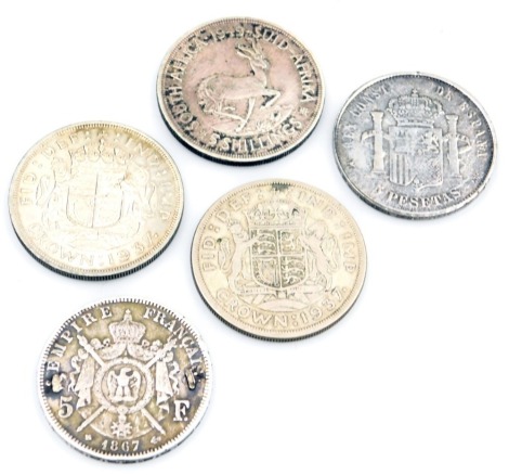 Five various coins, comprising a 1949 South African five shilling, two 1937 crowns, a Napoleon III 1897 five franc, and a five peso dated 1892. (5)