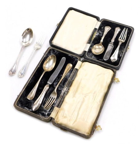 An Elizabeth II child's cutlery set, comprising spoon, knife and fork, Birmingham 1961, a fork and spoon set, bearing crest, London 1890, and a cased child's presentation set, with silver handles and stainless steel blades, 6.72oz, two boxed. (a quantity)