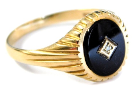 A gentleman's 9ct gold black onyx and diamond signet ring, size Y, 3.7g.