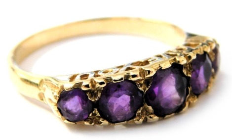 A 9ct gold and amethyst graduated five stone ring, in a claw setting, spelling 'I Love You', size O, 2.2g.