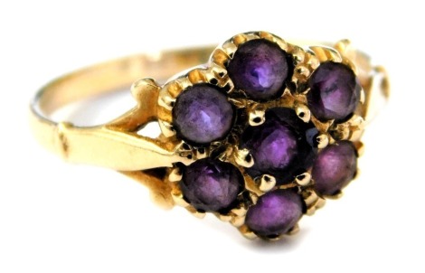 A 9ct gold and amethyst seven stone flower head ring, size O, 2.1g.