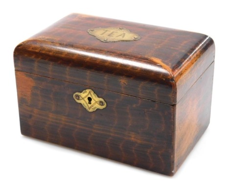 A Victorian faux rosewood tea caddy, with a brass escutcheon engraved 'Tea', opening to reveal twin lidded compartments, 18cm wide.