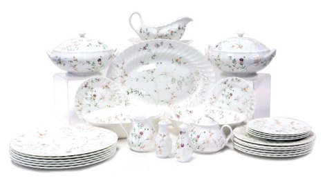 A Wedgwood porcelain Campion pattern part dinner service, comprising oval meat platter, two serving bowls, pair of vegetable tureens and covers, salt and pepper, sauce boat on stand, six dinner, dessert and side plates, together with a cream jug and sucri