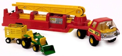 A Tonka fire tender, number 23, together with a tractor and trailer. (3)