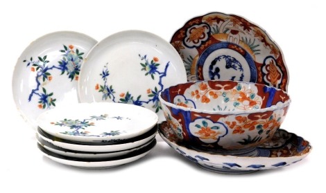 Six Chinese porcelain plates, decorated with fruit, together with an Imari fluted bowl, an oval dish and a plate. (8)(AF)