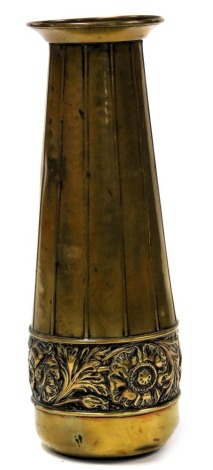 A Purely British Arts and Crafts vase, embossed with a band of flowers, impressed marks, 28cm high. (AF)