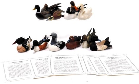 Twelve Danbury Mint figures of birds, the Wildfowl Showcase, with certificates.