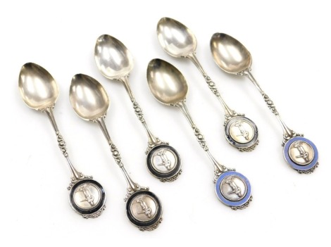 A set of six George V silver and enamel teaspoons, with terminals embossed with a hunter with gun, Birmingham 1913, 4.14oz.