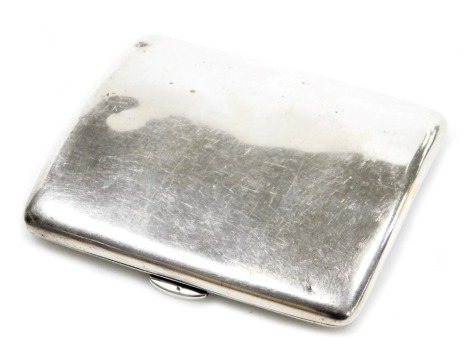 An Edward VII silver cigarette case, of curved plain form, Birmingham 1906, 2.63oz.