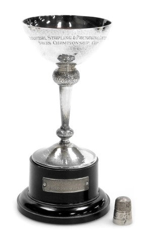 An Elizabeth II silver chalice, presentation engraved, with foliate engraved knops, Mappin and Webb, Sheffield 1968, together with a silver thimble, 5.43oz.