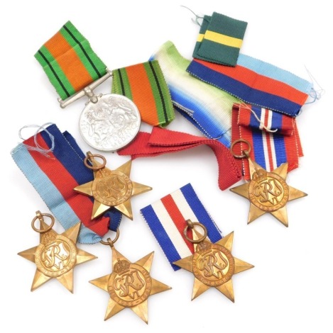 Various WWII medals, including 1939-45 Defence Medal, four 1939-45 Stars, and a France and Germany Star, and various medal ribbons.