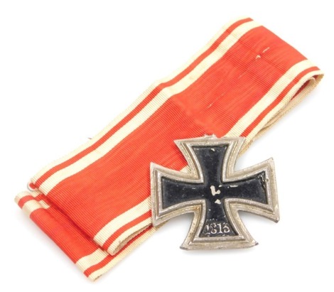 A German Iron Cross, with ribbon. (AF)