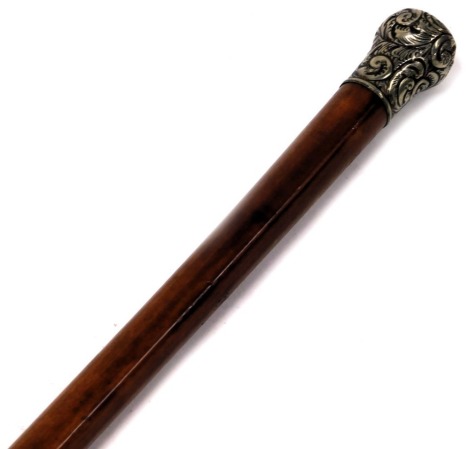 A gentleman's malacca walking cane, with scroll design nickel silver handle, 86cm long.