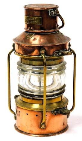 A World War II period copper and brass anchor light, by G. Pocock and Company Limited, Birmingham, dated 1940, Patt.4893, 25cm high.