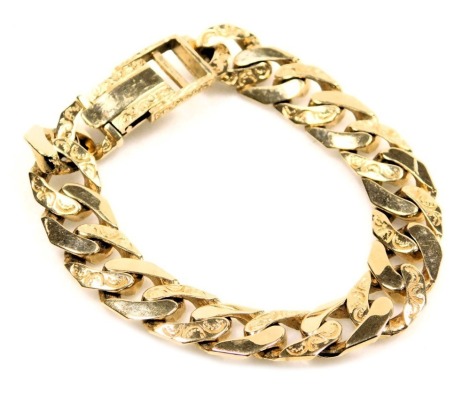 A 9ct gold gentleman's curb link bracelet, with plain and engraved links, on an over clip clasp, 59.4g.