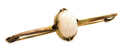 An Edwardian opal set bar brooch, in yellow metal, cased.