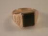 A 9ct gold and onyx ring