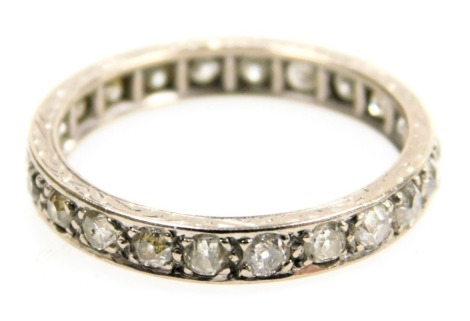 A diamond full eternity ring, set in white metal, approximately &#8532?ct, size O, 2.6g.