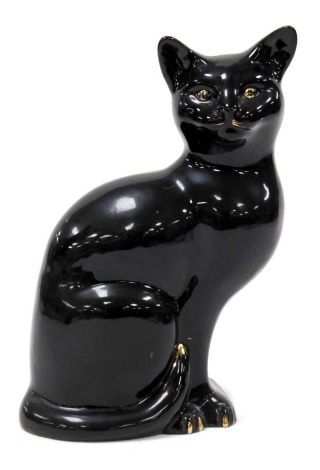 A Beswick pottery figure of a black seated cat, number 1560, printed and impressed marks, 19cm high.