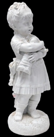 A late 19thC Continental parian figure of a girl standing holding a doll, on a circular base, 66cm high.