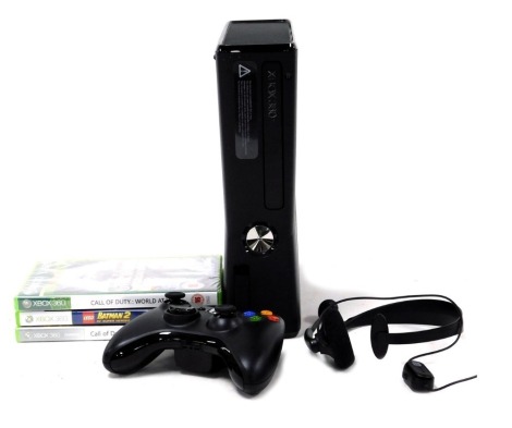 An Xbox 360, with controller, and three games.