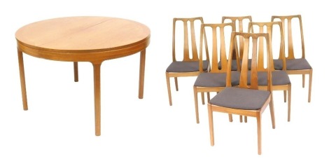 A Nathan teak draw leaf circular dining table, raised on tapering square legs, 75cm high, 122cm wide, 169cm extended, together with six dining chairs, with brown overstuffed seats.