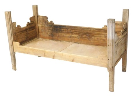 A 19thC Chinese elm day bed, with carved supports, 176cm wide, 76cm deep.