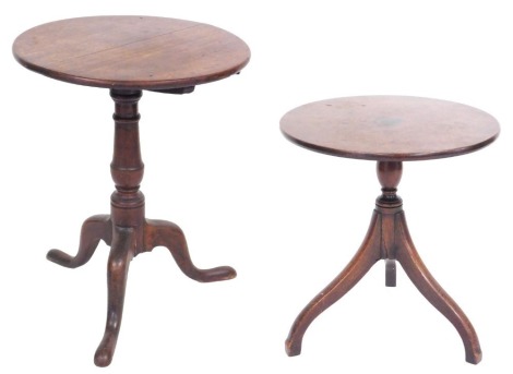 A George III oak tilt top occasional table, raised on a turned column over three cabriole legs, 70cm high, 55cm diameter, and a late Georgian mahogany occasional table, cut down, raised on three scrolling legs, 57cm high, 52cm diameter. (2)