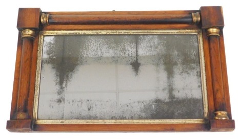 A Regency rosewood and parcel gilt over mantel mirror, with rectangular mirrored plate, 75cm wide.