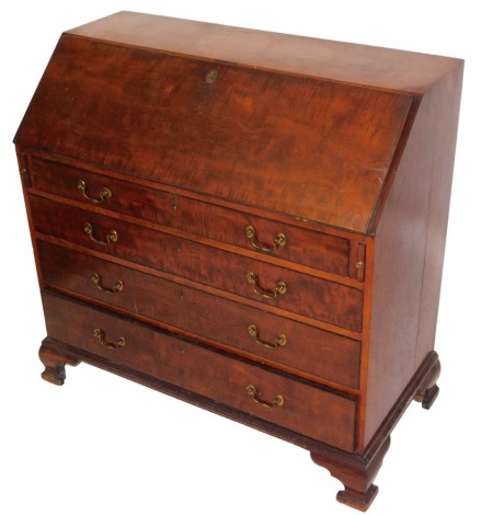 A George III mahogany bureau, the fall flap opening to reveal a central door flanked by eight recesses and six drawers, over four long graduated drawers, raised on ogee bracket feet, 110cm high, 110cm wide, 53.5cm deep.