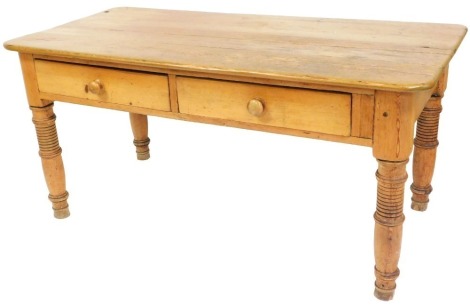 A Victorian pine farmhouse kitchen table, with a five plank top over a pair of frieze drawers, raised on turned legs, 76cm high, 159cm wide, 77cm wide.