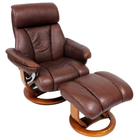 A Stressless type brown leather armchair, 86cm wide, and matching footstool. (2)