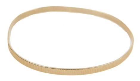 A 9ct gold bangle, 8.1g.