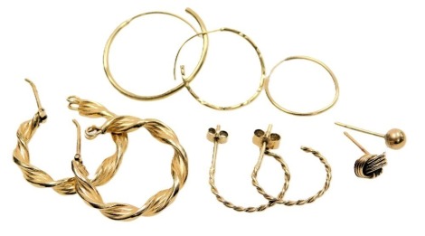 A pair of 9ct gold hoop earrings, pair of half hoop earrings, and five single earrings or studs, 3.5g.