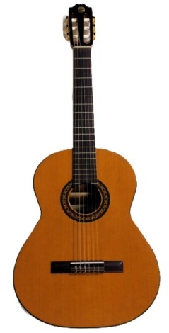 An Admira Virtuoso acoustic guitar.