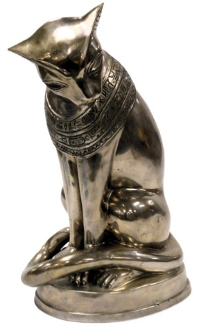 A cast metal figure of an Egyptian cat, in seated pose, on an oval base, 48cm high.