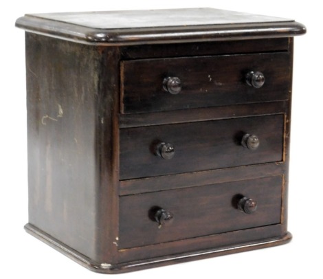 A Victorian mahogany apprentice chest, of three long graduated drawers, raised on a plinth base, galleried back lacking, 28cm high, 30cm wide, 22cm deep.