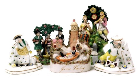 A group of Staffordshire figures, including a group with mother and child, farmer with pig and Wesleyan preacher, another of Grace Darling, and two figures of a boy and girl with sheep. (5)